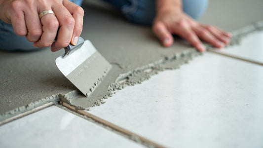 Installing large-format porcelain tile, spreading thinset mortar between tiles